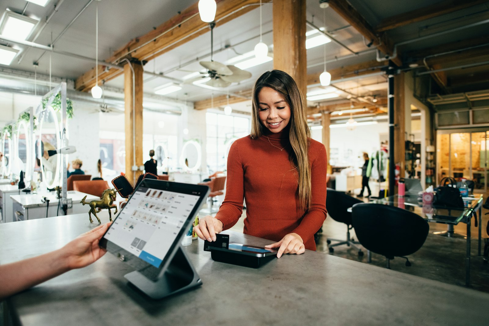 Customer paying at a small business counter
